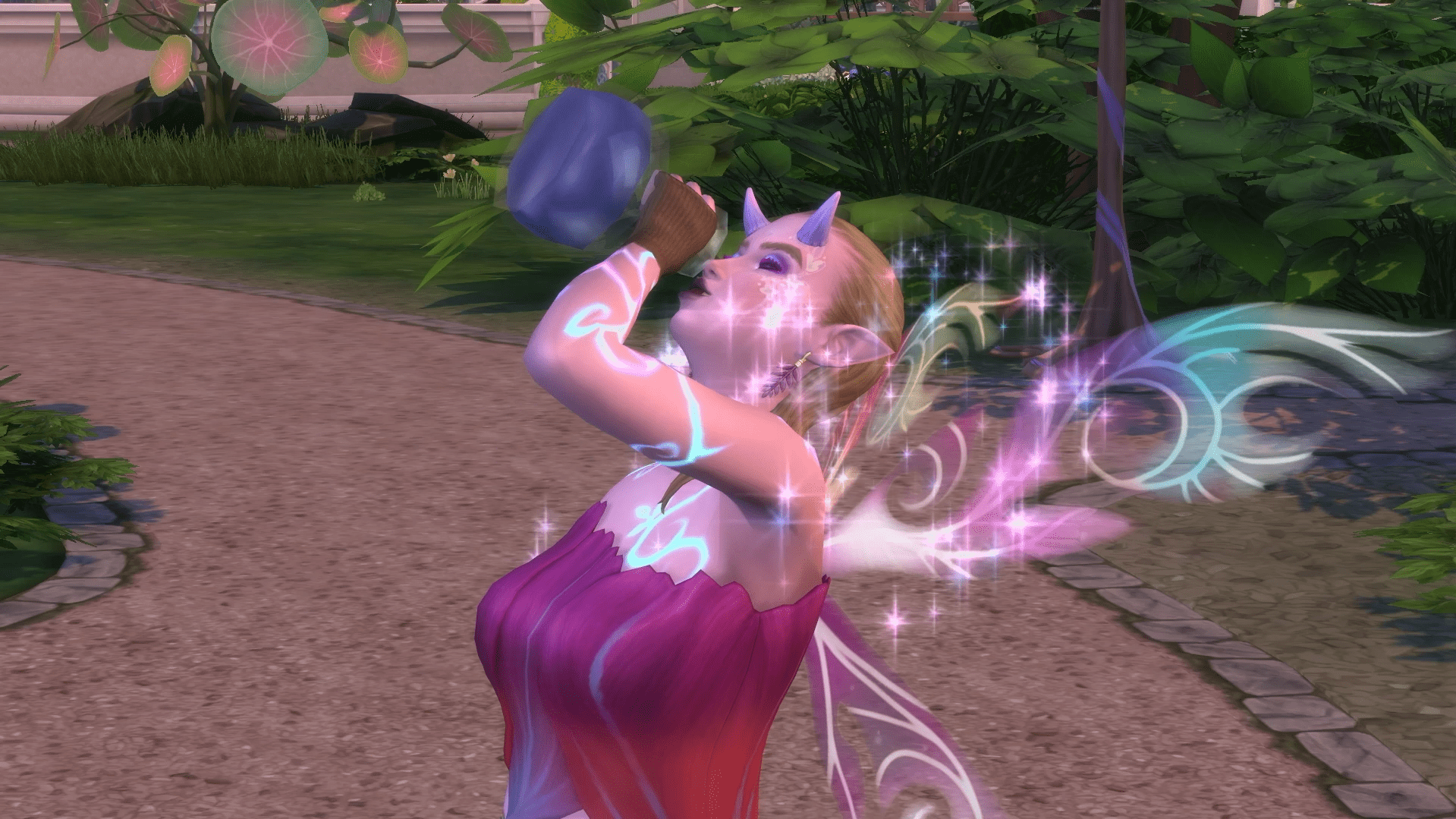 A glowing fairy Sim with luminescent wings and body markings drinks a sparkling potion outdoors, surrounded by magical sparkles.